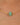 Gold necklace with a green bead on a person's neck
