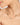 Necklace with green and pink beads on a woman's neck against a neutral background