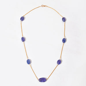 Necklace with purple gemstones on a white background