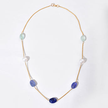 Necklace with purple and white beads on a white background