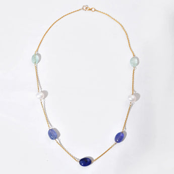 Necklace with purple and white beads on a white background