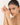 Woman with a minimalist bracelet on a plain background