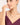 Woman wearing a necklace with a plain background