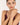 Woman wearing a bracelet on a plain background