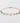 Gold bracelet with green beads and a pearl on a light gray background