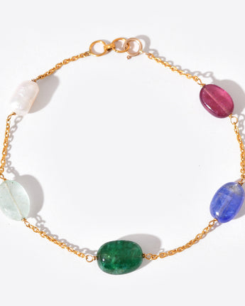 Bracelet with multicolored gemstones on a white background
