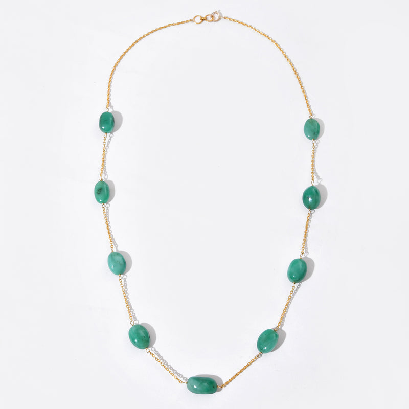 Necklace with green beads on a white background