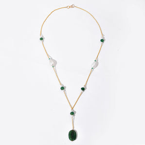 Necklace with green and white beads on a white background